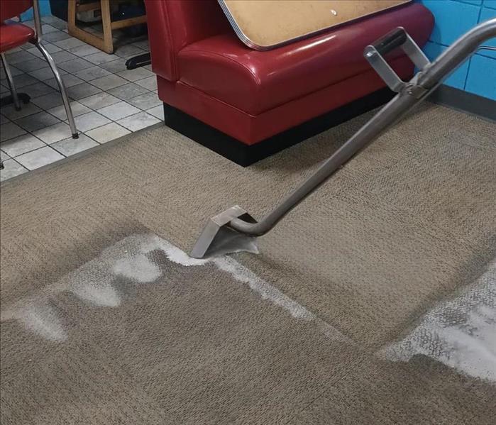 Cleaning carpet at a local restaurant. 